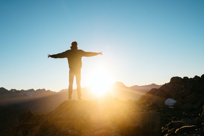Photo by Pablo Heimplatz person standing on hill