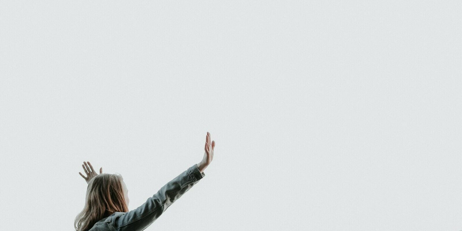 woman raising her hands