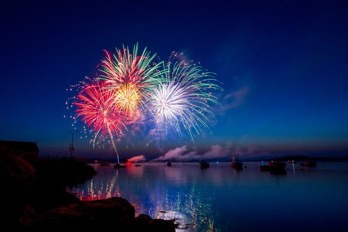 Photo by Ray Hennessy green, red, and white fireworks on sky at nighttime