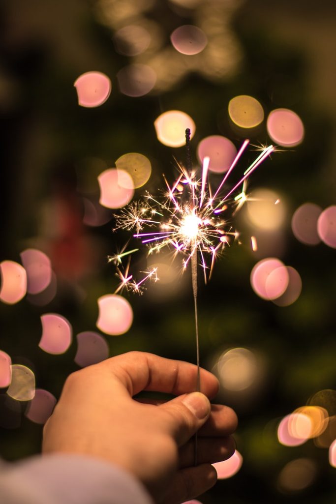 Photo by Wout Vanacker bokeh photography of person holding fireworks