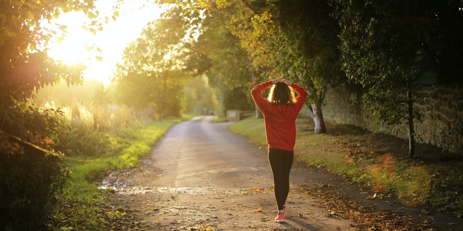 Photo by Emma Simpson woman walking on pathway during daytime