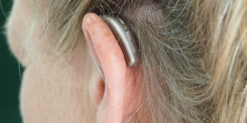 Photo by Mark Paton woman wearing silver hoop earrings